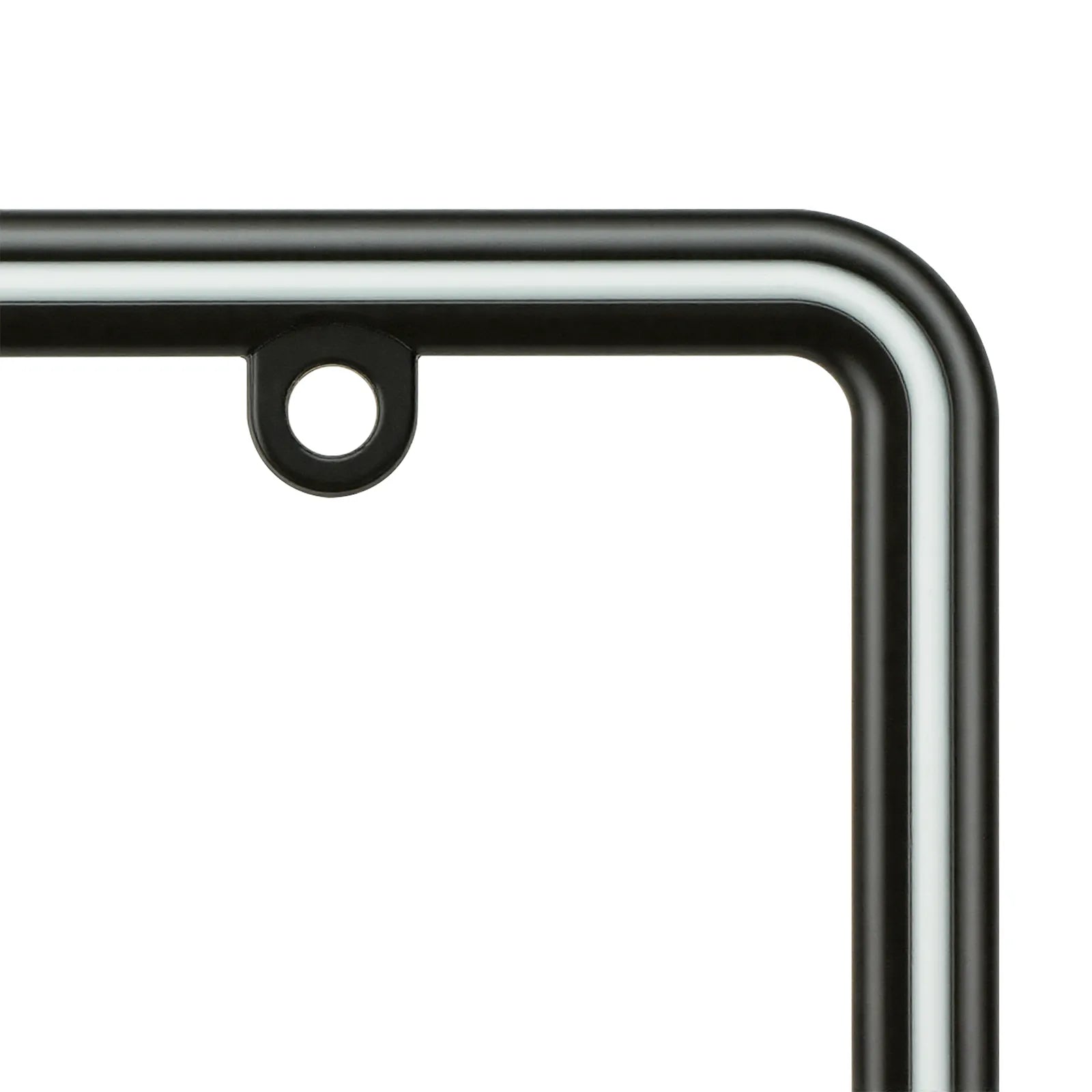 Detailed view of the top mounting tab and smooth curved edges on the Cleanstroke glossy black zinc license plate frame with white epoxy stripe.